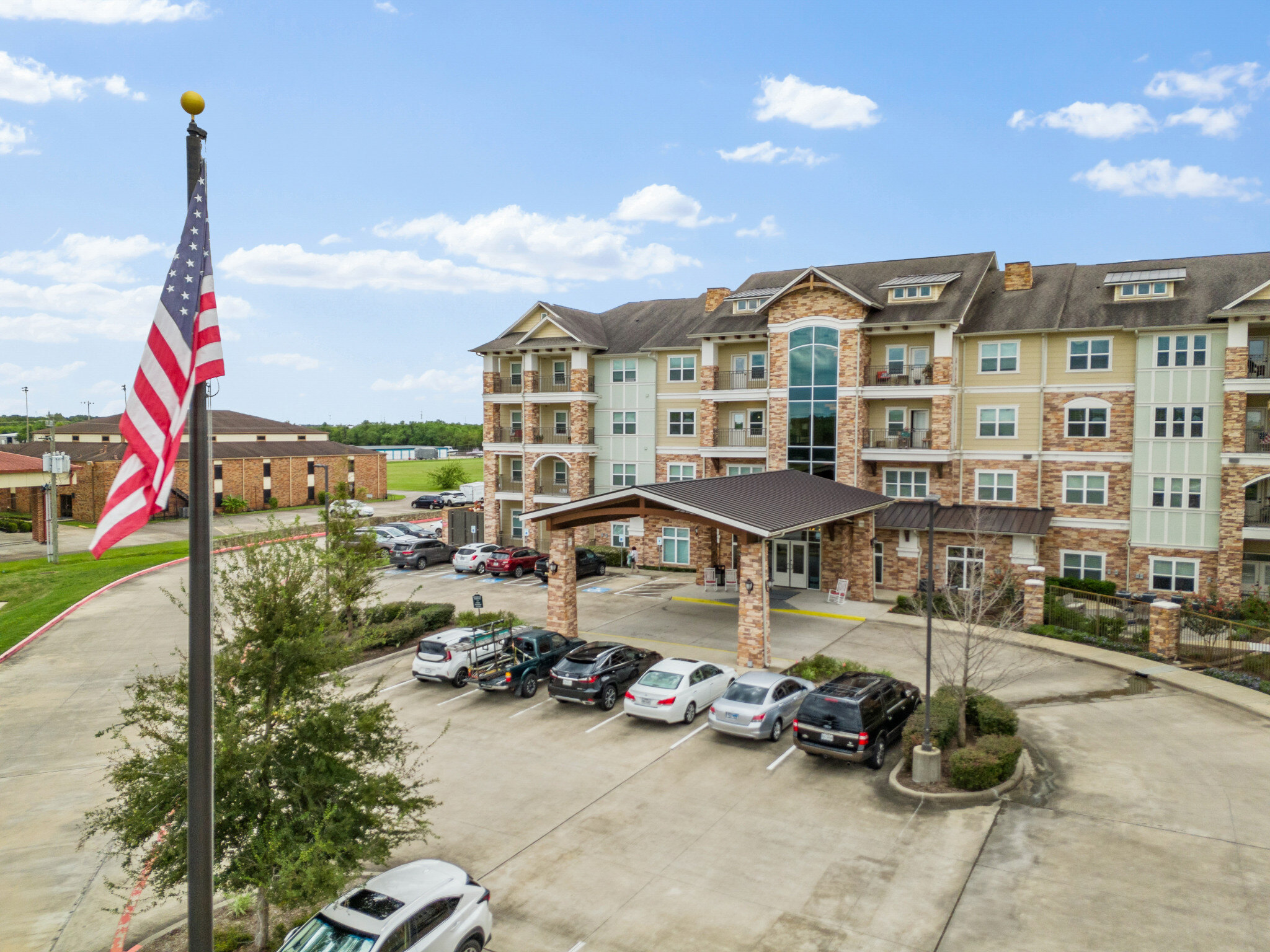 Discovery Village Clear Lake building exterior with US flag